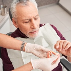 Man with dentures at the dentist