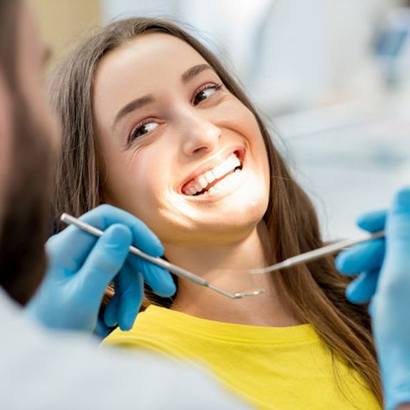 Woman smiles before getting tooth-colored fillings in Lancaster