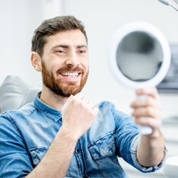 Man smiling after visiting cosmetic dentist in Lancaster