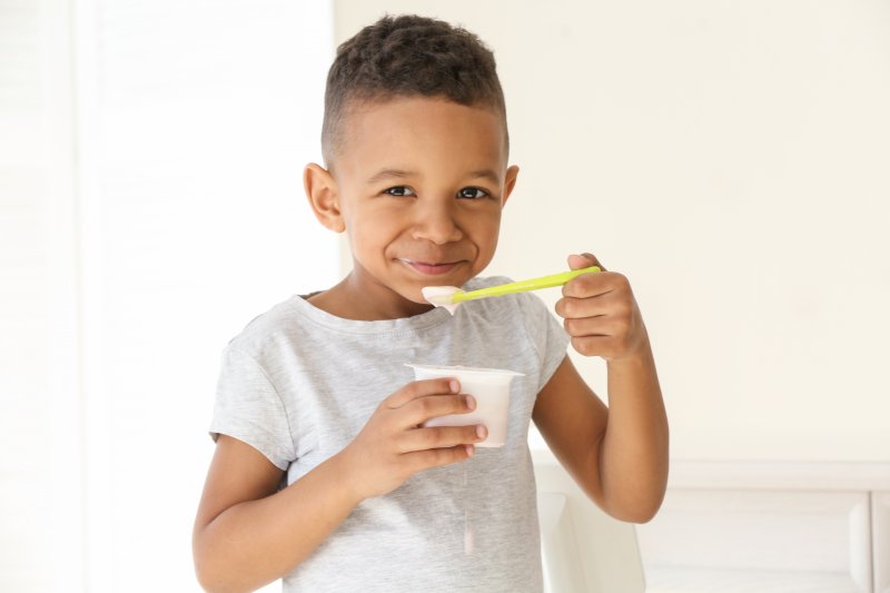 Boy eating yogurt