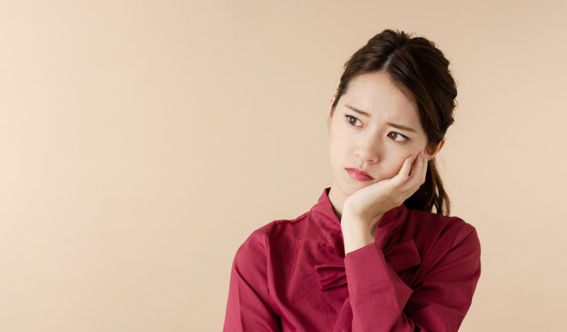 Woman experiencing enamel wear