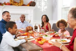 three generations of family having Thanksgiving meal